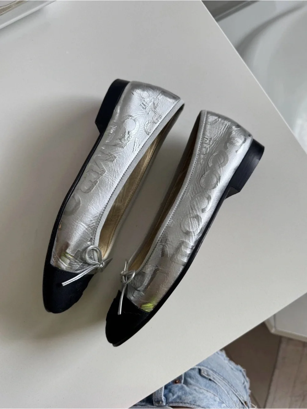 CHANEL Silver Leather Ballerina Flats with Black Cap Toe